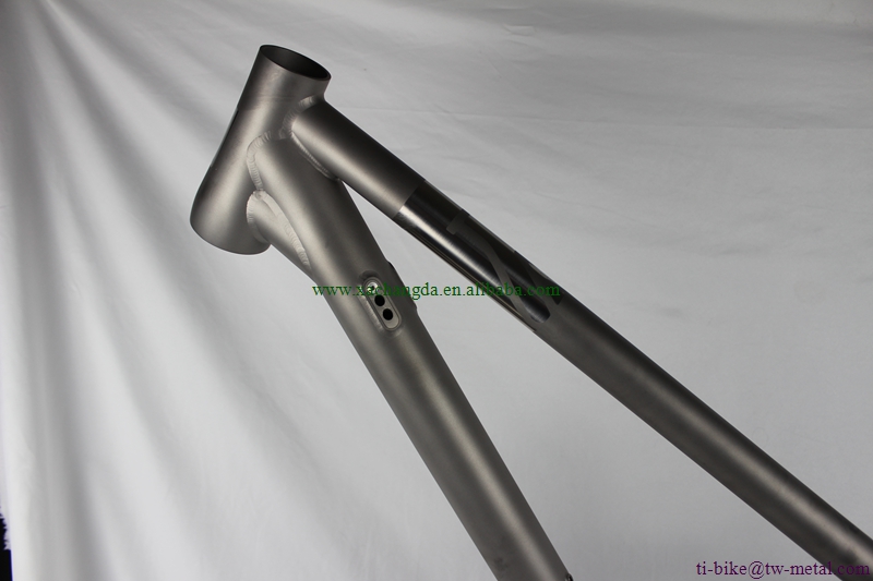 custom titanium suspension bicycle frame with tapered head tube and thru axle dropouts