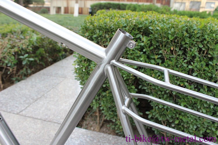 Titanium gravel bike frame with integrated rear rack