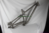 custom titanium suspension bicycle frame with tapered head tube and thru axle dropouts