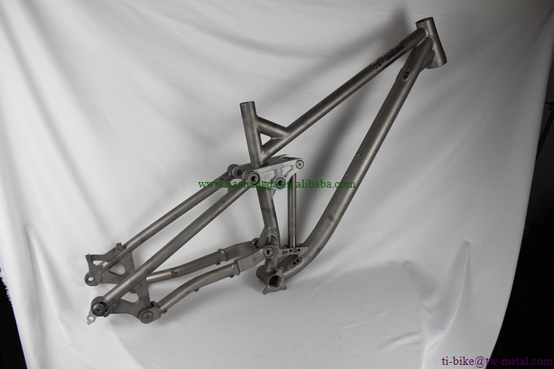 custom titanium suspension bicycle frame with tapered head tube and thru axle dropouts