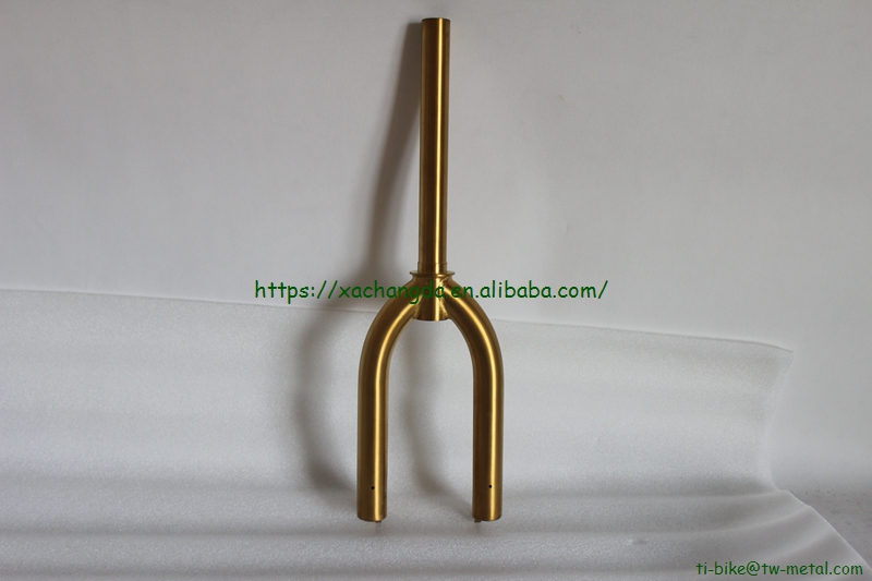 titanium BMX bike frame with integrated head tube in golden color