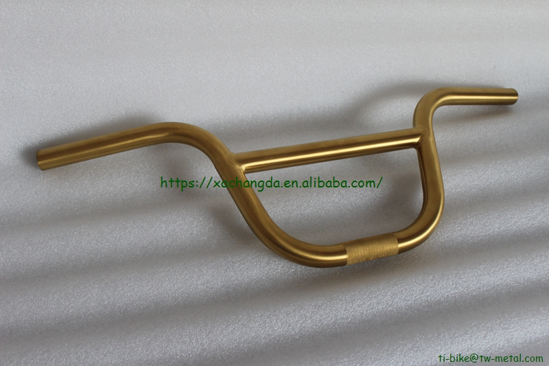 titanium BMX bike frame with integrated head tube in golden color