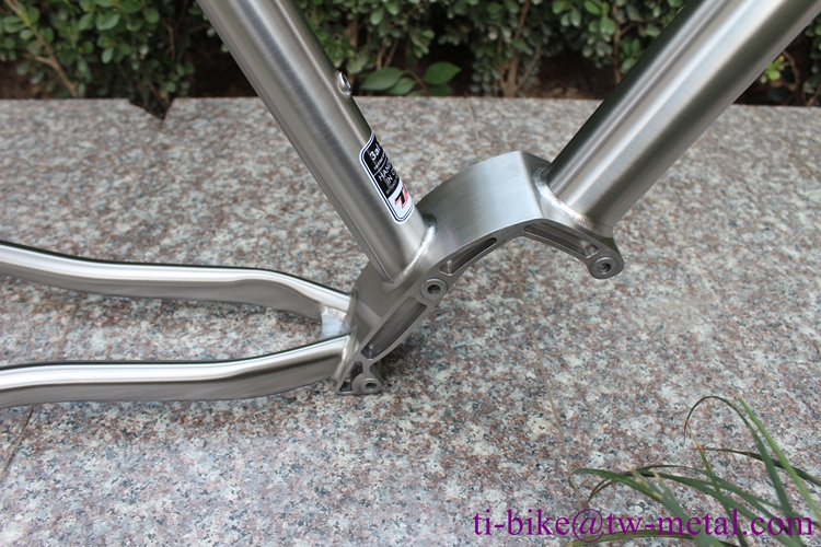 Titanium gravel bike frame with integrated rear rack