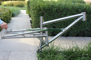 Titanium suspension bike frame with thru axle design