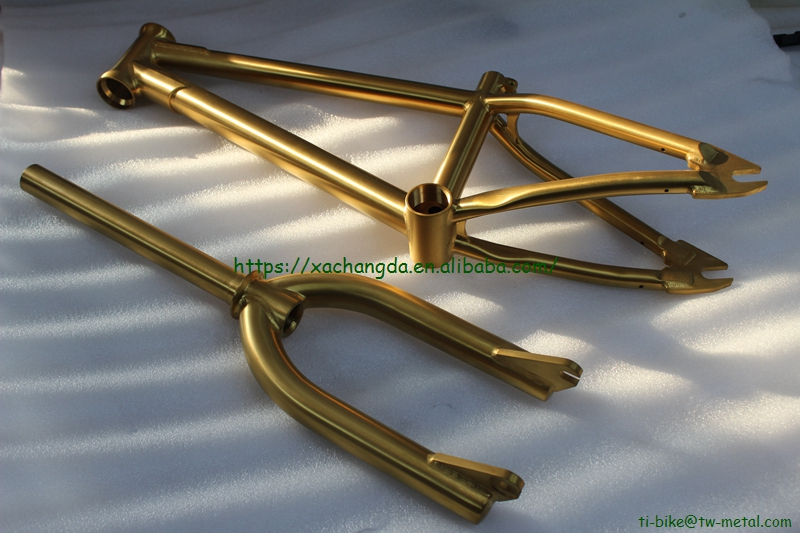 titanium BMX bike frame with integrated head tube in golden color