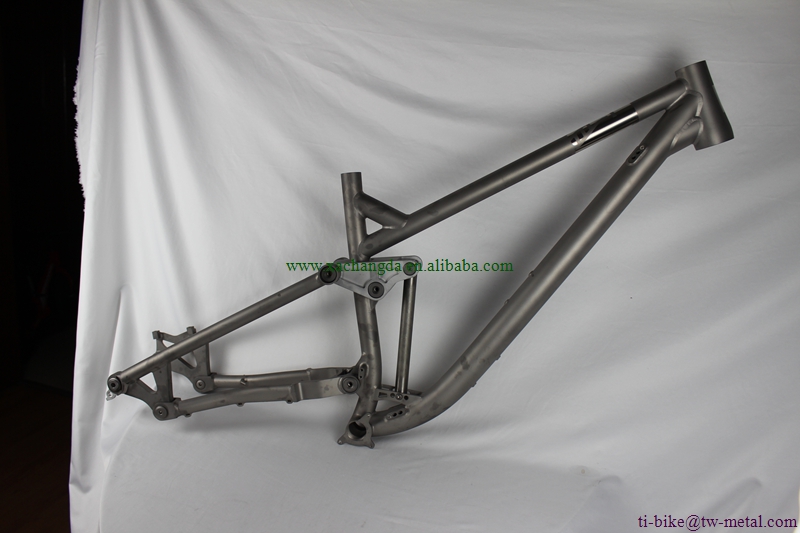custom titanium suspension bicycle frame with tapered head tube and thru axle dropouts